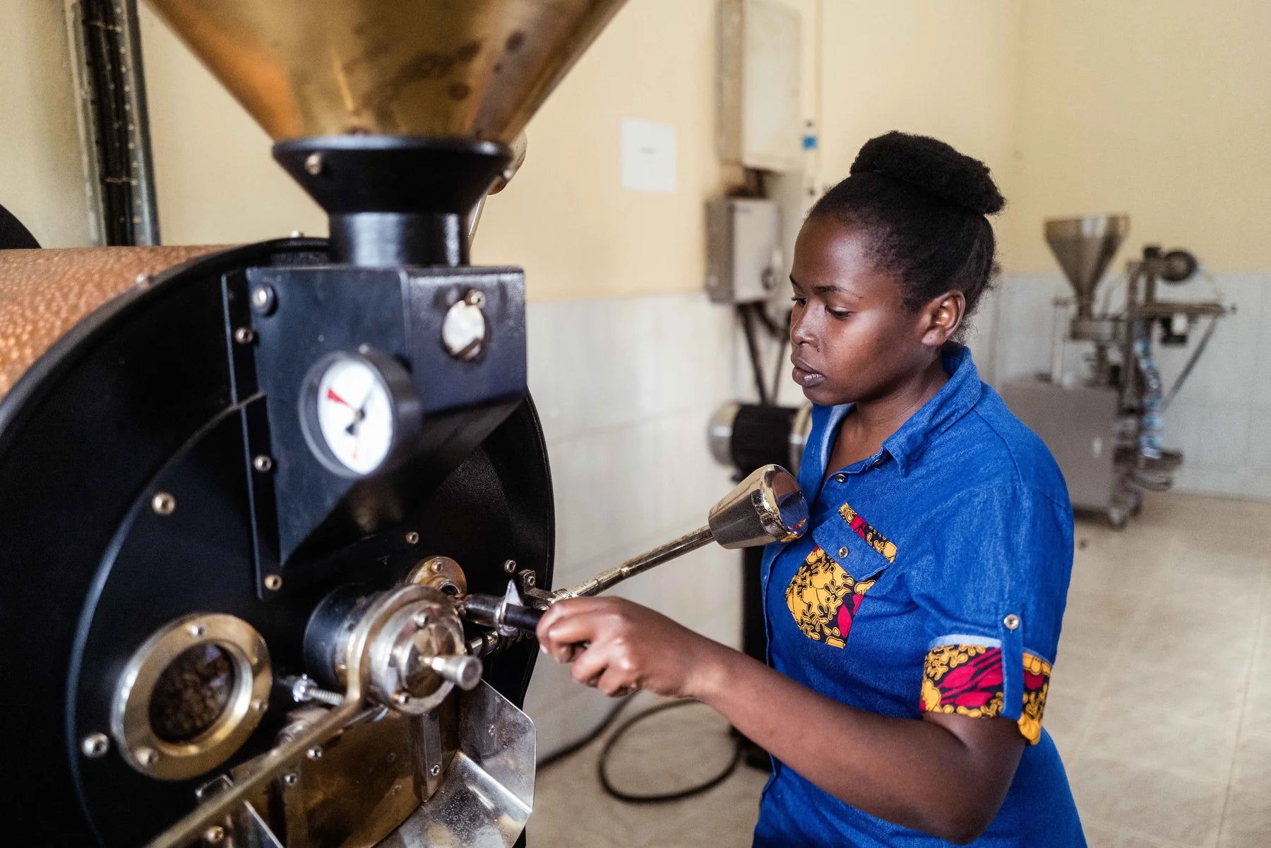 Roasting Anna uganda women coffee empowerment